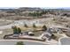 Expansive aerial view of home near a traffic circle, mountains in the distance at 1206 Baldwin Park Cir, Castle Rock, CO 80104