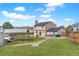 Spacious backyard with green lawn, large shed, and open carport at 1206 Baldwin Park Cir, Castle Rock, CO 80104