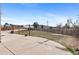 Spacious backyard features a concrete patio and wood fence, offering privacy and outdoor living space at 1206 Baldwin Park Cir, Castle Rock, CO 80104