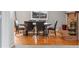 Dining room with wood floors, brick fireplace, and neutral wall paint at 1206 Baldwin Park Cir, Castle Rock, CO 80104