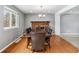 Bright dining room with hardwood floors and a fireplace, ideal for Gathering meals at 1206 Baldwin Park Cir, Castle Rock, CO 80104