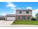 Charming two-story home with attached two-car garage and well-maintained lawn at 1206 Baldwin Park Cir, Castle Rock, CO 80104
