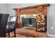 Cozy brick fireplace with wood storage and decorative mantel at 1206 Baldwin Park Cir, Castle Rock, CO 80104