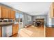 Open kitchen/dining area with hardwood floors and fireplace, perfect for entertaining at 1206 Baldwin Park Cir, Castle Rock, CO 80104