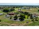 Expansive property with horse amenities, large barn, and well-maintained grounds on a sunny day at 17450 E 14Th Dr, Aurora, CO 80011