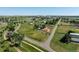 Aerial view of the sprawling property highlighting the spacious lot, outbuildings, and surrounding landscape at 17450 E 14Th Dr, Aurora, CO 80011