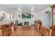 Elegant dining area with a fireplace, and seamless transition to the adjacent kitchen at 17450 E 14Th Dr, Aurora, CO 80011