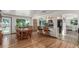 Open dining area with a view to the bar, stainless kitchen, and access to the outdoor space at 17450 E 14Th Dr, Aurora, CO 80011