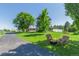 Inviting front yard with a fire pit and comfortable seating, perfect for outdoor gatherings at 17450 E 14Th Dr, Aurora, CO 80011