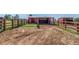 Outdoor horse pens with sturdy wooden fencing and shelters at 17450 E 14Th Dr, Aurora, CO 80011