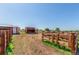 Horse pens and shelters under a bright blue sky at 17450 E 14Th Dr, Aurora, CO 80011