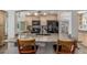 Kitchen features granite countertops, custom cabinets, and modern appliances, offering style and functionality at 17450 E 14Th Dr, Aurora, CO 80011
