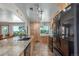 Spacious kitchen features granite countertops and custom cabinets, perfect for cooking and entertaining at 17450 E 14Th Dr, Aurora, CO 80011