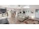 Spacious living room with tile flooring, skylight, and comfortable seating at 17450 E 14Th Dr, Aurora, CO 80011