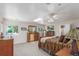 Spacious main bedroom with skylight, soft carpet, updated wood furniture, and abundant natural light at 17450 E 14Th Dr, Aurora, CO 80011