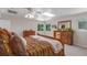 Bright main bedroom with skylight, offering plenty of natural light and ample space with updated furniture at 17450 E 14Th Dr, Aurora, CO 80011