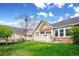 Well-maintained backyard with green grass, a stone border and privacy fence at 6617 S Reed Way # C, Littleton, CO 80123