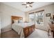 Inviting bedroom featuring a comfortable bed and natural light at 6617 S Reed Way # C, Littleton, CO 80123