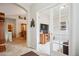Welcoming foyer with tile flooring, archway, and doorway to a cozy living room showcasing neutral tones and natural light at 6617 S Reed Way # C, Littleton, CO 80123