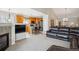 Open-concept living space with a modern kitchen, casual dining area, and a comfortable living room for relaxation and entertainment at 6617 S Reed Way # C, Littleton, CO 80123