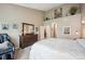 Comfortable bedroom with high ceilings and a well-organized walk-in closet at 6617 S Reed Way # C, Littleton, CO 80123