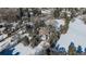 Aerial view of a house with large backyard in snowy landscape at 3750 S Ogden St, Englewood, CO 80113