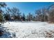 Aerial view of property showcasing a large snow covered yard and surrounding homes at 3750 S Ogden St, Englewood, CO 80113