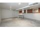 Unfinished basement area with concrete floors and exposed brick at 3750 S Ogden St, Englewood, CO 80113