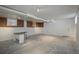 Spacious finished basement with concrete floors and a corner desk at 3750 S Ogden St, Englewood, CO 80113