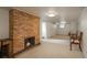 Finished basement area with brick fireplace at 3750 S Ogden St, Englewood, CO 80113