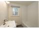 Clean bathroom with a white bathtub and subway tile at 3750 S Ogden St, Englewood, CO 80113