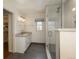 Modern bathroom with granite vanity and glass shower at 3750 S Ogden St, Englewood, CO 80113