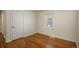 Well-lit bedroom featuring hardwood floors and a closet at 3750 S Ogden St, Englewood, CO 80113