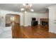 Living area with hardwood floors, fireplace, and built-in shelving at 3750 S Ogden St, Englewood, CO 80113