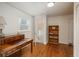 Home office with hardwood floors and built-in shelves at 3750 S Ogden St, Englewood, CO 80113