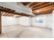 Unfinished basement with high ceilings and window at 9691 Independence Dr, Westminster, CO 80021