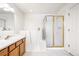 Bathroom includes a walk-in shower and a soaking tub at 9691 Independence Dr, Westminster, CO 80021