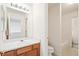 Well-lit bathroom with vanity, sink and bathtub at 9691 Independence Dr, Westminster, CO 80021
