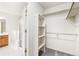Spacious bedroom closet with built-in shelves and hanging rods at 9691 Independence Dr, Westminster, CO 80021