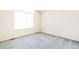 Bright bedroom with neutral carpeting and large window at 9691 Independence Dr, Westminster, CO 80021