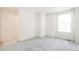 Spacious bedroom featuring neutral walls and carpeting at 9691 Independence Dr, Westminster, CO 80021