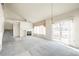 Bright living room with high ceilings and patio access at 9691 Independence Dr, Westminster, CO 80021