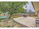 Wide shot of backyard featuring patio, pergola, fencing, landscaping, and an above-ground pool at 18240 E Mexico Pl, Aurora, CO 80017