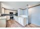 Open-concept kitchen with white cabinets, stainless steel appliances and space for customization at 18240 E Mexico Pl, Aurora, CO 80017
