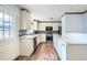 Bright kitchen featuring white cabinets, stainless steel appliances and a backsplash at 18240 E Mexico Pl, Aurora, CO 80017
