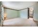 Bright living room with fresh paint, carpet, natural light, and a view of the kitchen at 18240 E Mexico Pl, Aurora, CO 80017