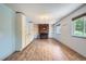 Spacious living area features a brick fireplace, hardwood floors, and custom built-in cabinets at 18240 E Mexico Pl, Aurora, CO 80017
