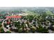 Great aerial view of the property in a tranquil neighborhood with mature trees and nearby golf course at 1013 E 130Th Dr, Thornton, CO 80241