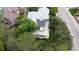 A beautiful aerial shot of the property featuring a spacious deck with outdoor seating amid lush greenery at 1013 E 130Th Dr, Thornton, CO 80241