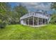 Large backyard with patio seating underneath the deck, as well as well-manicured grass and a small storage shed at 1013 E 130Th Dr, Thornton, CO 80241